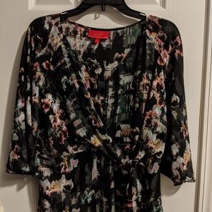 Jennifer Lopez black flowered shirt